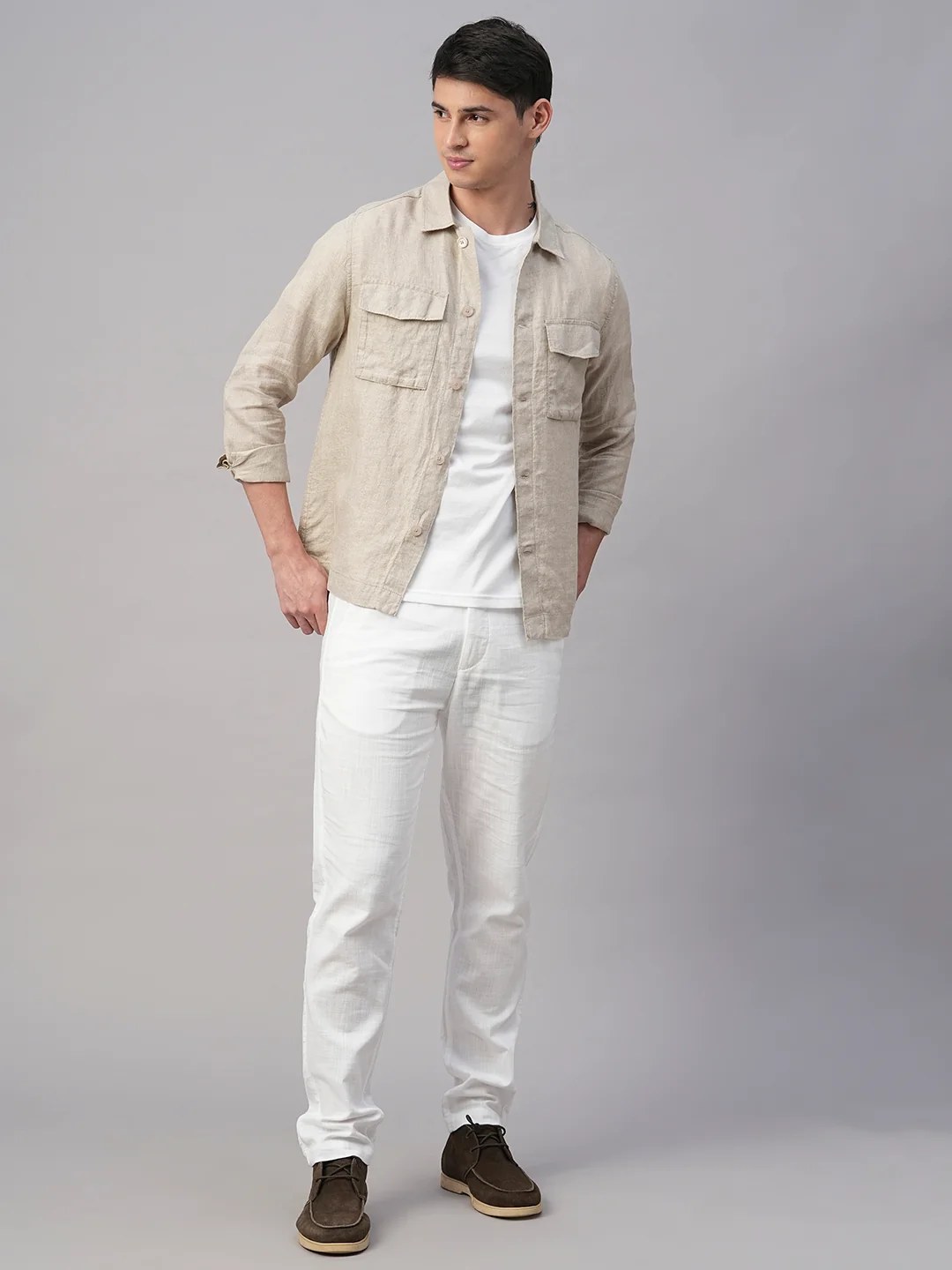 Model wearing a pale stone overshirt with matching trousers